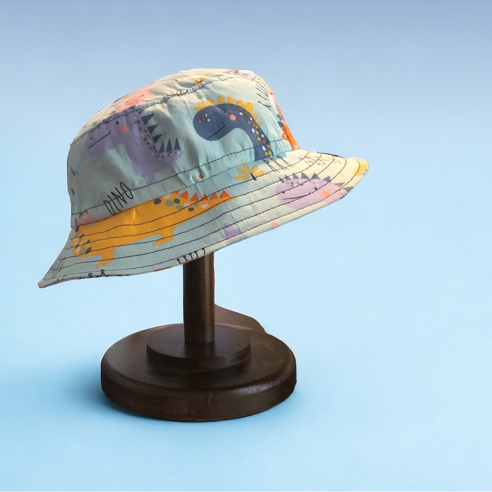 NWOT HANDMADE REVERSIBLE Childs bucket hat Dinosaur theme 19-20.5” circumference